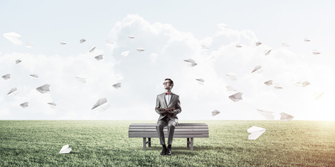 Young businessman or student studying the science and paper plan