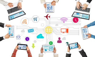 Top view of businesspeople sitting at table and using gadgets