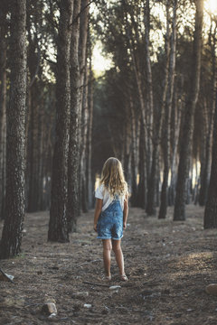 Happy child running in forest