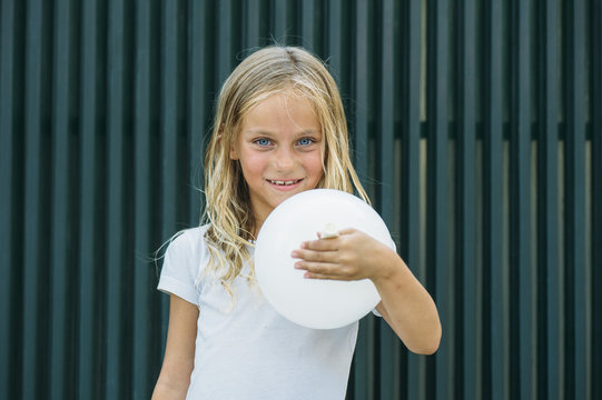 Girl posing with balloon