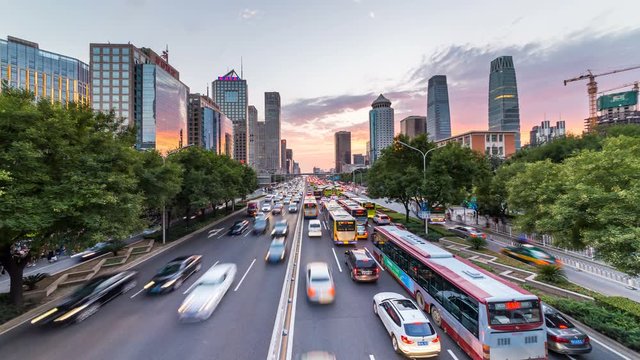 Time lapse of busy freeway traffic at sunset in beijing city，china  