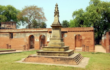 Fototapeta na wymiar Ancient Stone Cross in Lucknow, India. Former British residence 