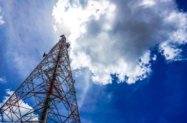 Blue sky on the background The cell phone tower is used to send phone signals.