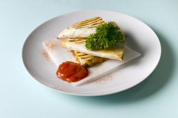 Quesadilla with chicken and cheddar cheese with sauce