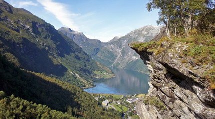 Fototapeta na wymiar Sunny view of the Geiranger fjord and the cliff, Norway