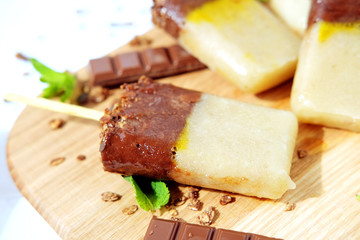 Homemade ice cream. Chocolate banana granola popsicles.