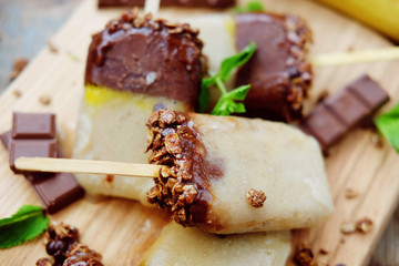 Homemade ice cream. Chocolate banana granola popsicles.