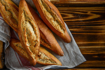 Homemade bread on a wooden background.