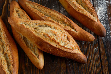 Homemade bread on a wooden background.