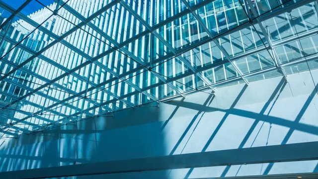 Time lapse of shadows passing over office buildings 