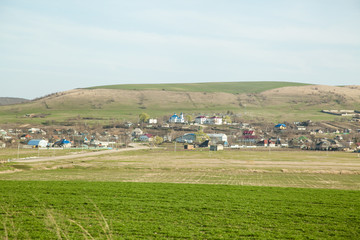 Fototapeta premium village houses with church and blue sky 