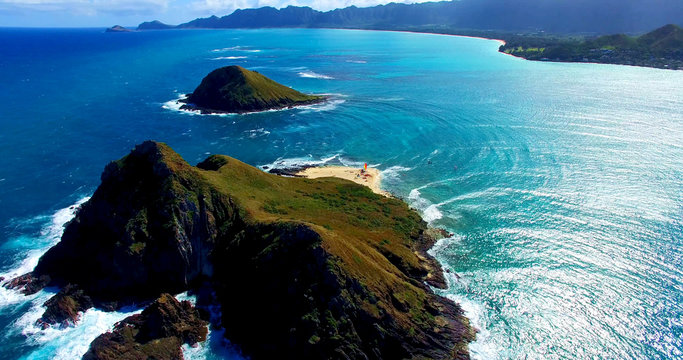 Two Remote Coastal Islands In The Pacific Ocean With A Small Beach Surrounded By Turquoise Blue Ocean Waters - Aerial Shot In Oahu, Hawaii