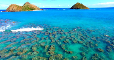 Small Reef in Turquoise Blue Coastal Waters with Two Small Islands - Oahu, Hawaii