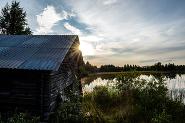 Boat house in sunset