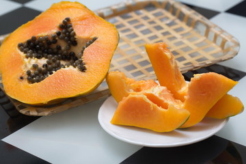 Fresh ripe papaya cut on the table