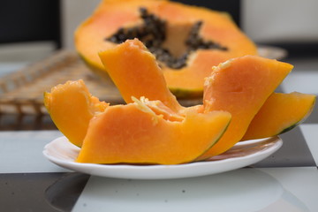 Fresh ripe papaya cut on the table