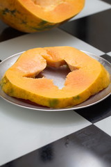 Fresh ripe papaya cut on the table