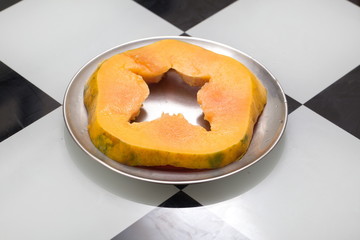 Fresh ripe papaya cut on the table