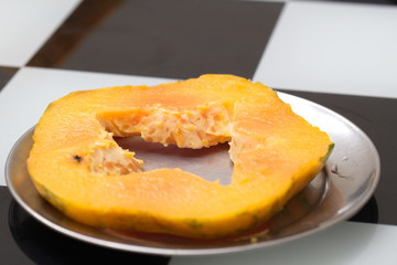 Fresh ripe papaya cut on the table