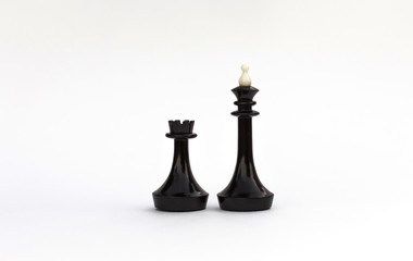 Fototapeta premium Chess pieces. The black king and rook on a white background. Castling