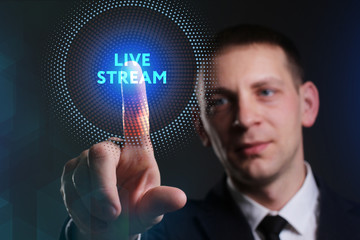 Business, Technology, Internet and network concept. Young businessman working on a virtual screen of the future and sees the inscription: Live stream