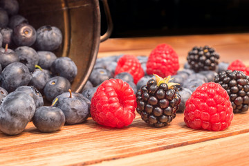Healthy mixed fruit, Blueberry. Fresh berries , blackberry, raspberry, on wooden table