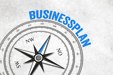 Kompass mit Businessplan