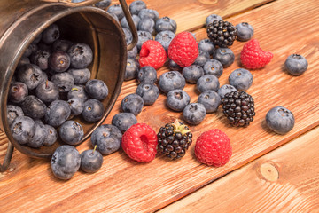 Healthy mixed fruit, Blueberry. Fresh berries , blackberry, raspberry, on wooden table