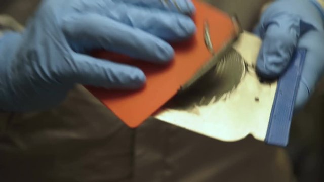 The mixing of auto primer on the spatula. 4K