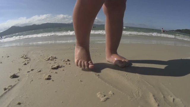 Baby / toddler / small child walking on the beach / sea. Feet close up. HD