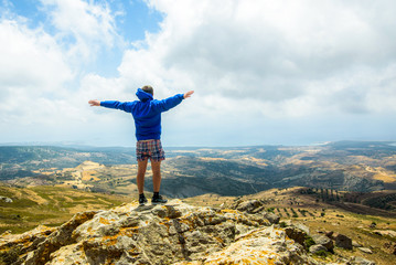 Happy man gesture of triumph with hands in the air