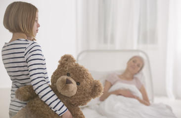 Girl visiting seriously ill mother