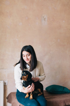 Woman with her dog indoor