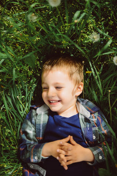 boy lying in the grass