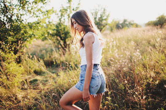 Sexy summer portrait of a beautiful brunette female