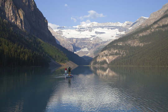 Paddling on the beautiful emerald colored water of Lake Louise in Banff national park, Alberta, Canada.