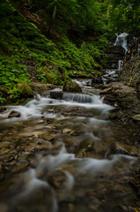 Fototapeta premium Landscape of waterfall Shypit in the Ukrainian Carpathian Mountains on the long exposure
