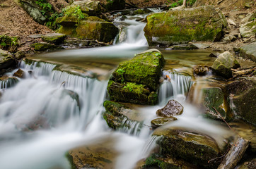 Naklejka na ściany i meble Landscape of waterfall Shypit in the Ukrainian Carpathian Mountains on the long exposure
