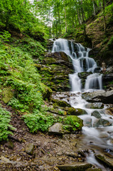 Obraz premium Landscape of waterfall Shypit in the Ukrainian Carpathian Mountains on the long exposure