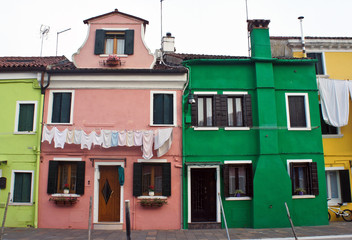 Colored paint facades of houses on the island of Burano near Venice, Italy