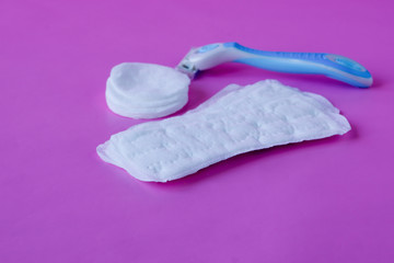 Means for feminine hygiene on purple background