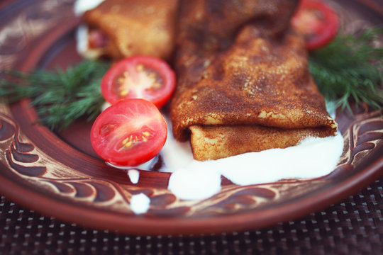 Pancakes with tomatoes and dil