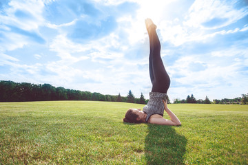 Young person practice yoga outdoors healthy lifestyle
