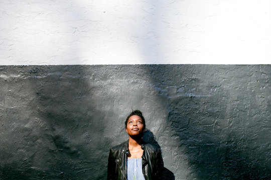 Woman looking up towards light