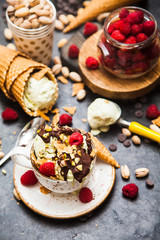 Pistachio ice cream with chocolate and raspberries