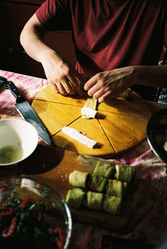 A young man making food