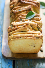 Homemade bread with cheese, salami and herbs