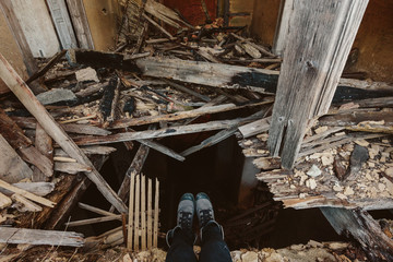 Female feet on ruined abandoned building backgroung