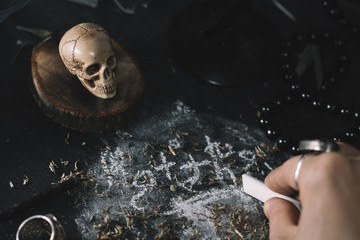 Witch during sinister ritual of Black magic.