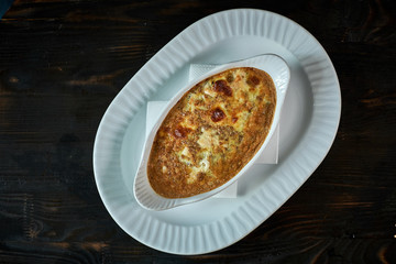 scrambled eggs with mushrooms and vegetables in a frying